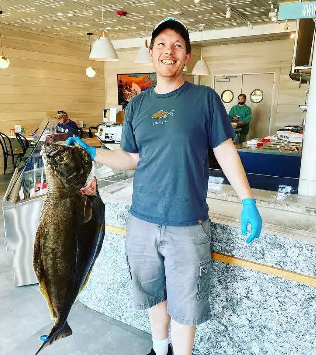 Matt with local halibut .webp__PID:ce13d0ac-f375-4a52-b2b6-c5625b1867d6